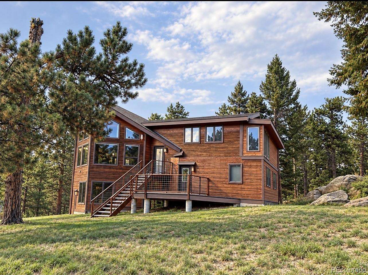 5.8 Acres of Land with Home for Sale in Evergreen, Colorado