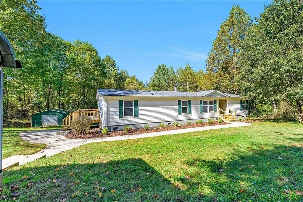 4.2 Acres of Land with Home for Sale in Roaring River, North Carolina
