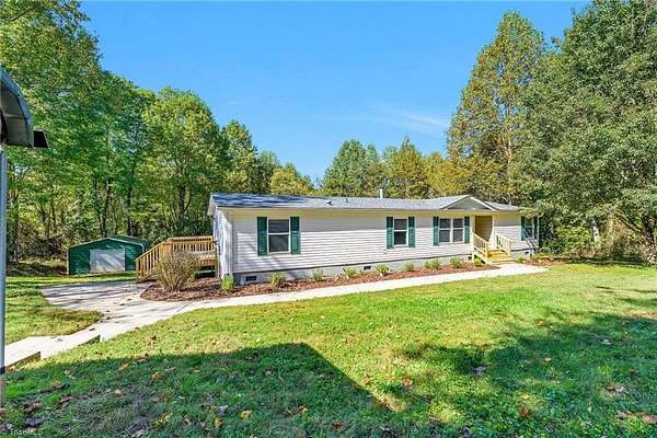 4.2 Acres of Land with Home for Sale in Roaring River, North Carolina