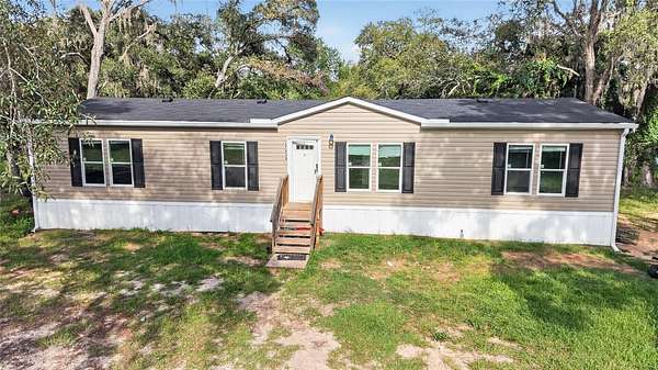 1.5 Acres of Land with Home for Sale in Spring Hill, Florida