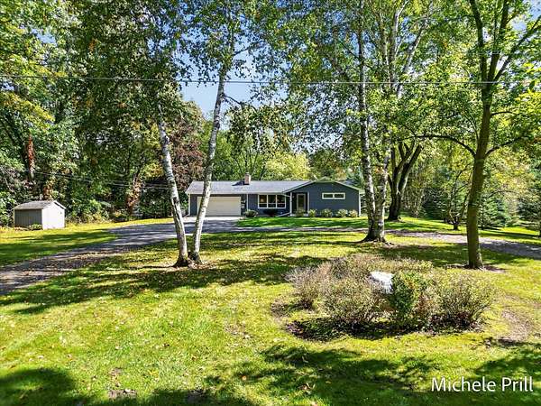 8 Acres of Land with Home for Sale in Alto, Michigan