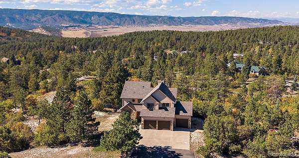 5.2 Acres of Land with Home for Sale in Larkspur, Colorado