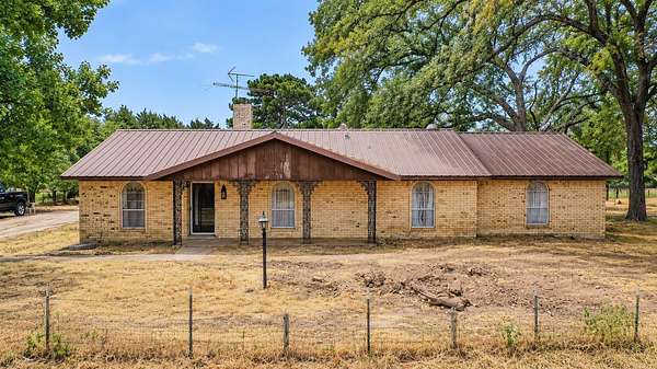 69.3 Acres of Agricultural Land with Home for Sale in Ravenna, Texas
