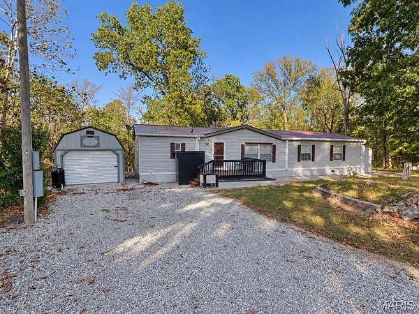 10.3 Acres of Land with Home for Sale in Richland, Missouri