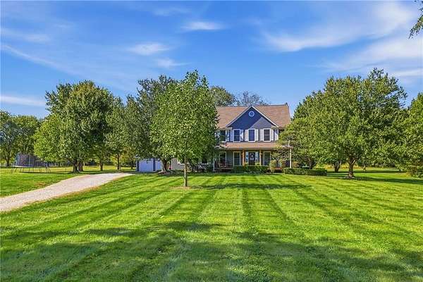 5 Acres of Land with Home for Sale in Peculiar, Missouri