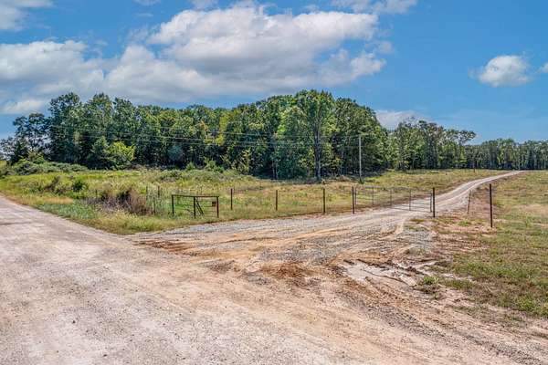 104 Acres of Land with Home for Sale in Cole Camp, Missouri