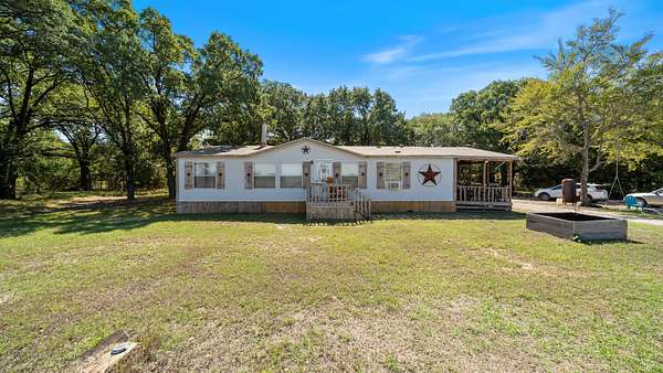 6.84 Acres of Land with Home for Sale in Scurry, Texas
