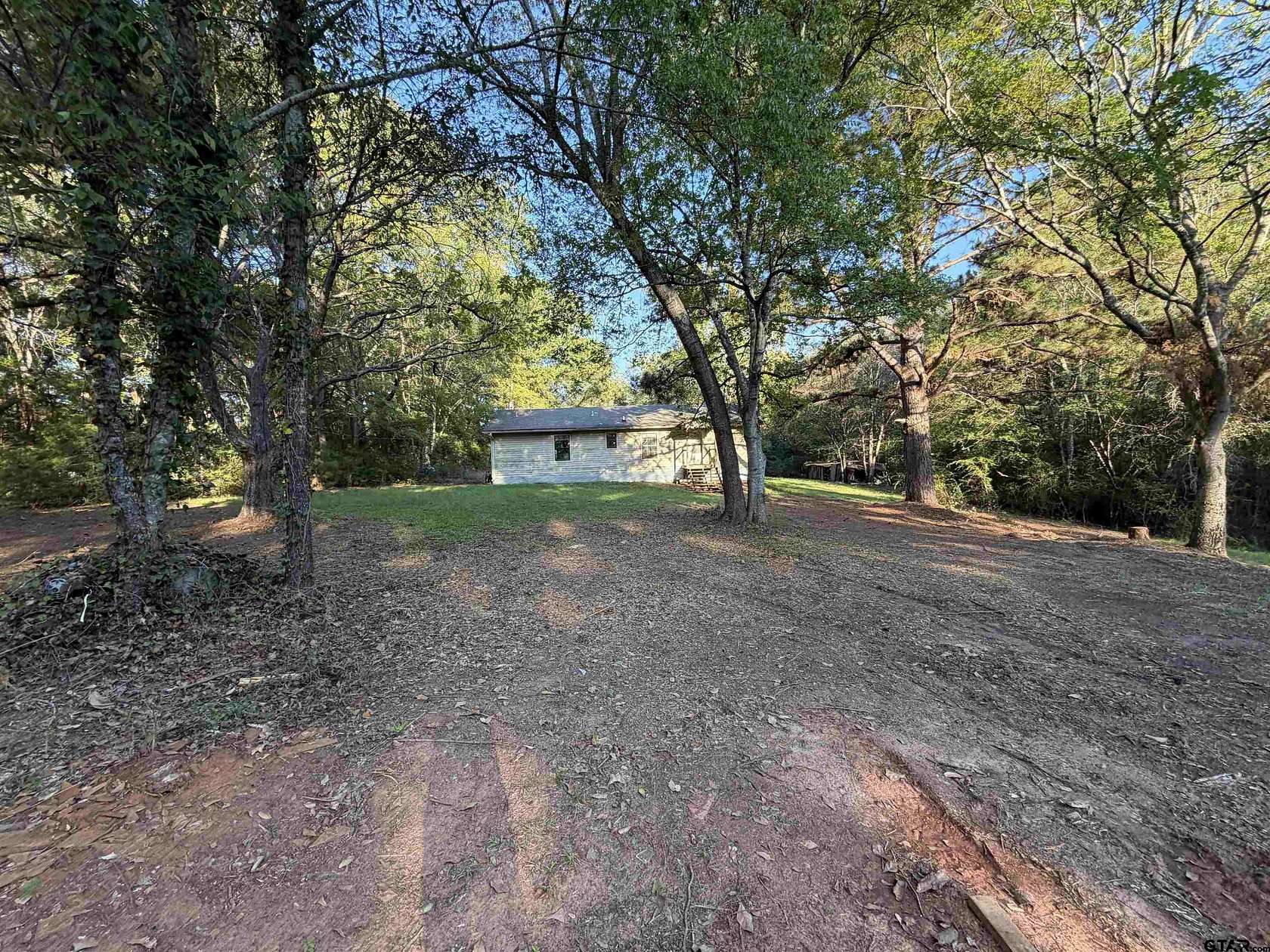 6.78 Acres of Land with Home for Sale in Jacksonville, Texas