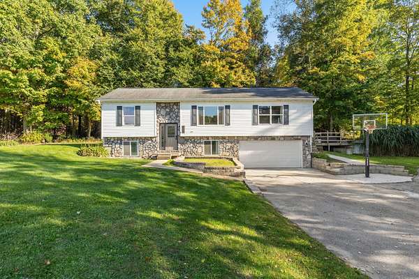 4 Acres of Land with Home for Sale in Saranac, Michigan