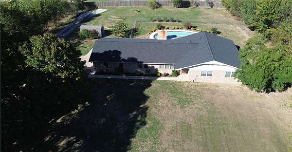 2.12 Acres of Land with Home for Sale in Elm Springs, Arkansas