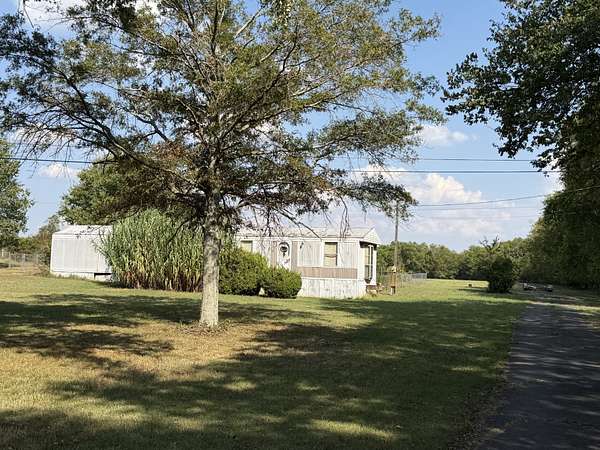 5.19 Acres of Land with Home for Auction in Lewisburg, Tennessee