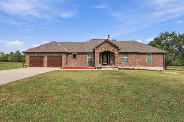 4.64 Acres of Land with Home for Sale in Belton, Missouri
