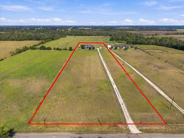 6.86 Acres of Land with Home for Sale in Wolfe City, Texas