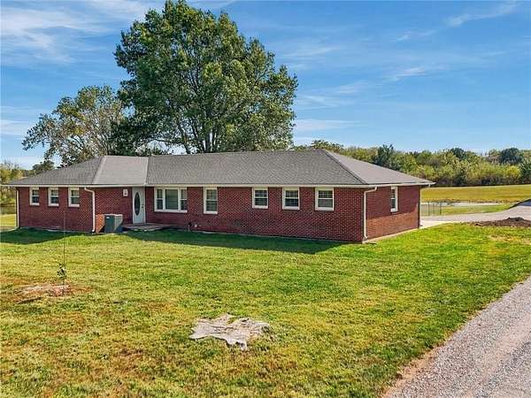 7.33 Acres of Land with Home for Sale in Odessa, Missouri