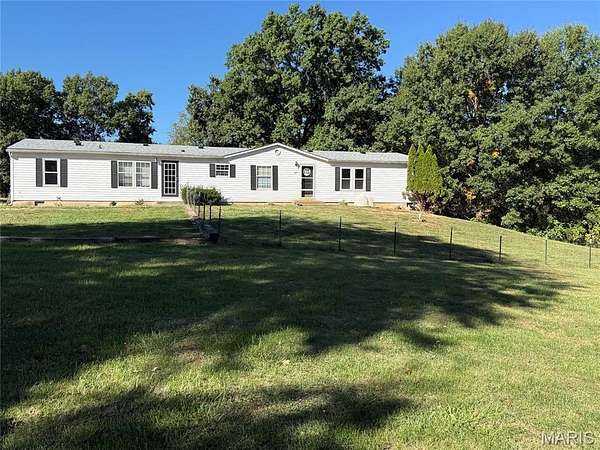 2.29 Acres of Land with Home for Sale in Foley, Missouri