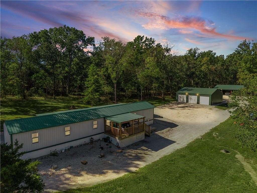 5 Acres of Land with Home for Sale in Deepwater, Missouri