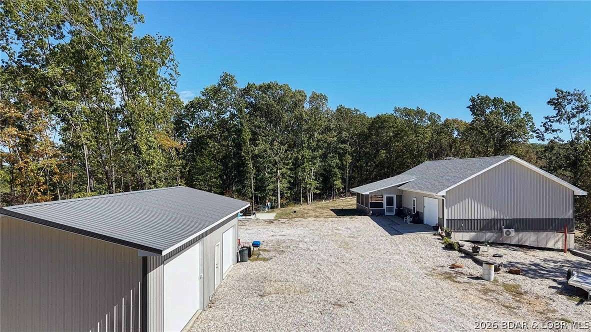14.7 Acres of Land with Home for Sale in Linn Creek, Missouri