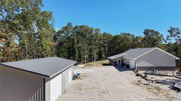 14.7 Acres of Land with Home for Sale in Linn Creek, Missouri