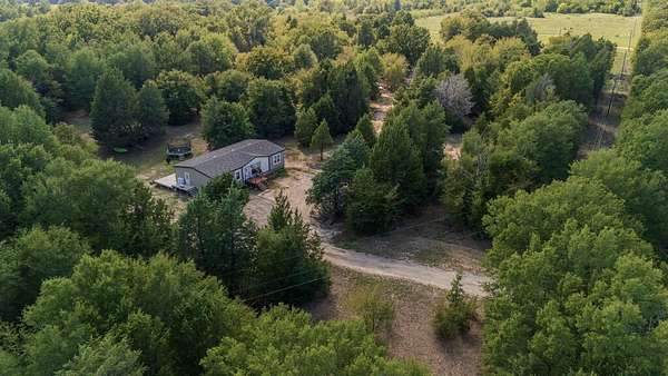 6 Acres of Land with Home for Sale in Payne Springs, Texas