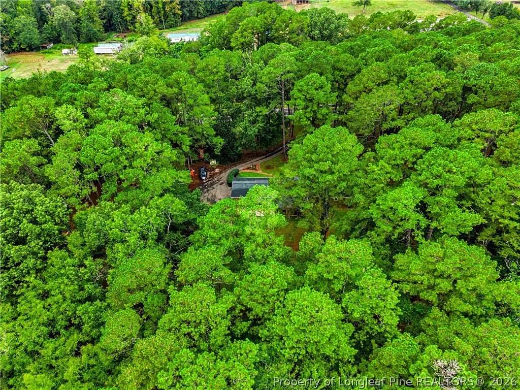 9.59 Acres of Land with Home for Sale in Sanford, North Carolina
