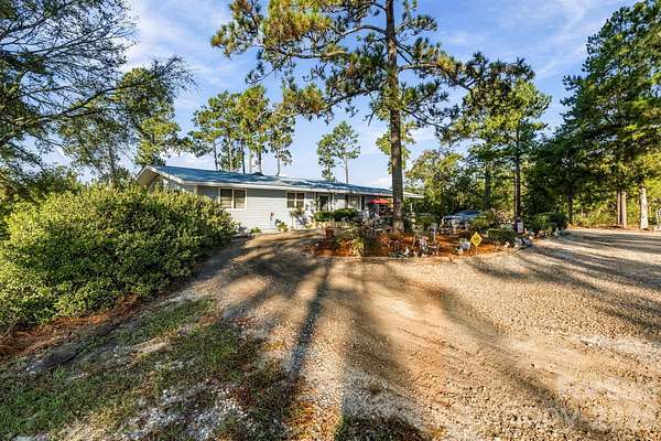 27.7 Acres of Land with Home for Sale in Laurel Hill, North Carolina