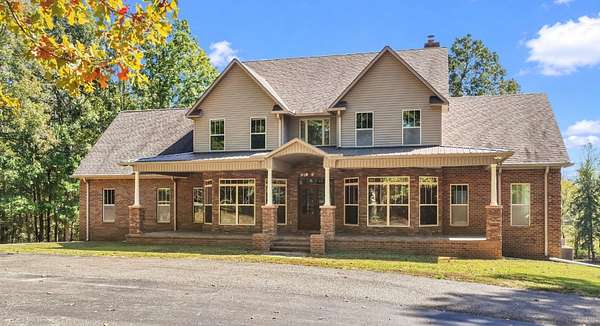 79.3 Acres of Land with Home for Sale in Henderson, Tennessee