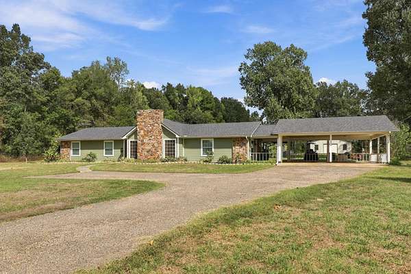 9.57 Acres of Land with Home for Sale in Carthage, Texas