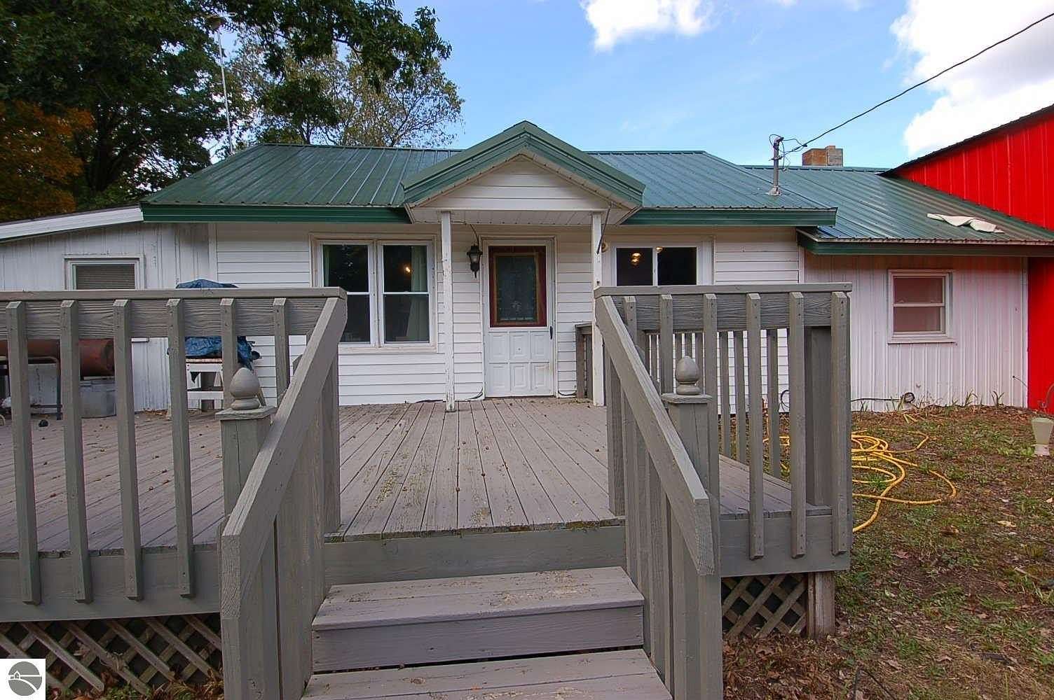 3.66 Acres of Land with Home for Sale in Harrietta, Michigan