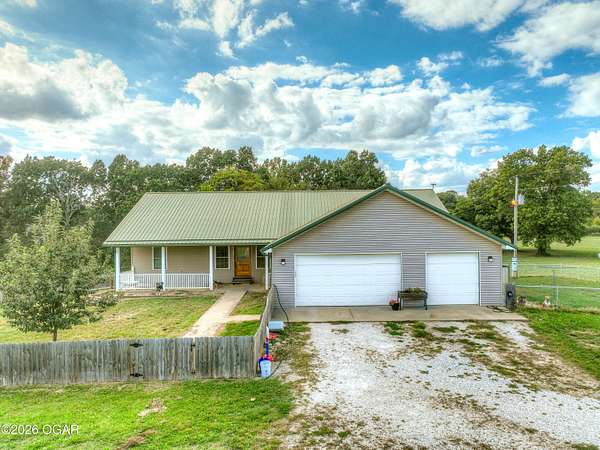 13.4 Acres of Land with Home for Sale in Goodman, Missouri