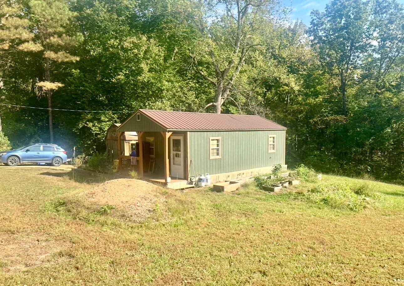 0.81 Acres of Land with Home for Sale in Camden, Tennessee