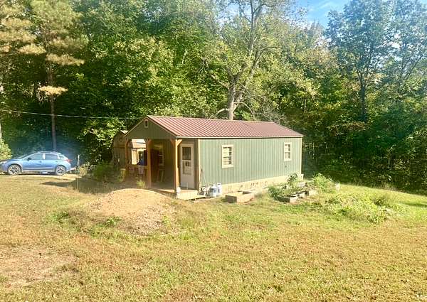 0.81 Acres of Land with Home for Sale in Camden, Tennessee
