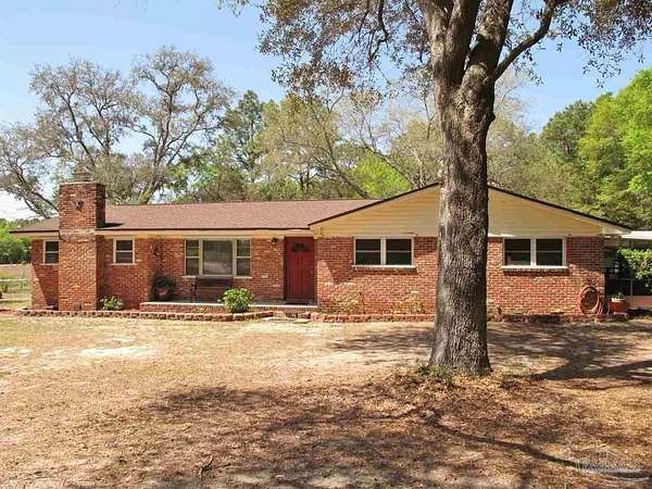 1.69 Acres of Land with Home for Sale in Milton, Florida