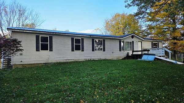 4 Acres of Land with Home for Sale in Remus, Michigan