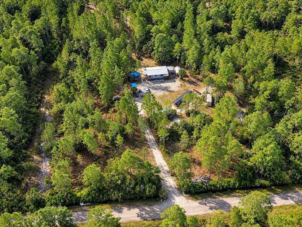 10 Acres of Land with Home for Sale in Mims, Florida