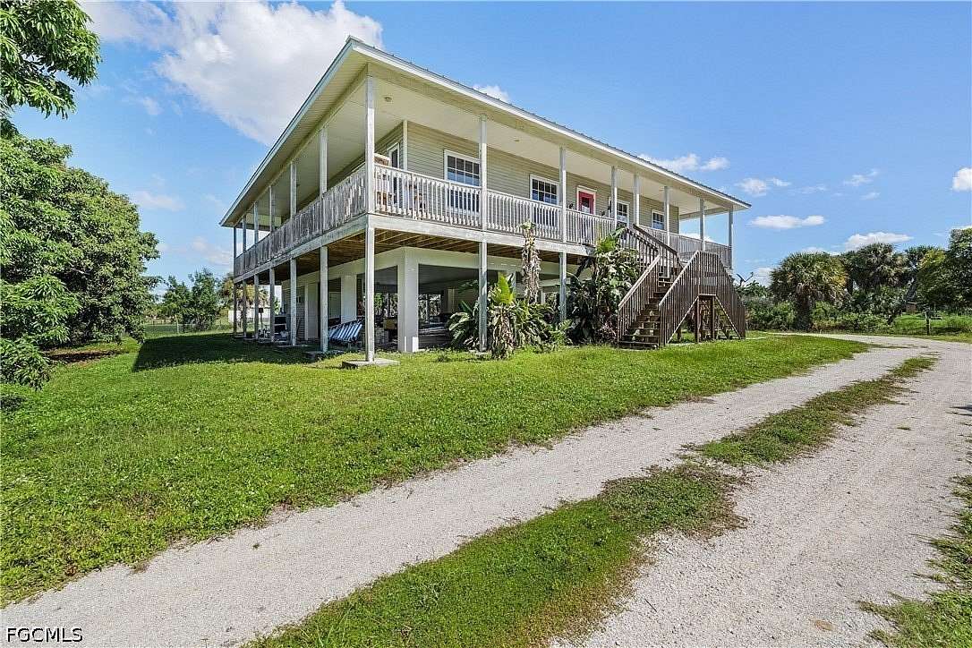 2.8 Acres of Land with Home for Sale in Bokeelia, Florida