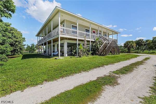 2.8 Acres of Land with Home for Sale in Bokeelia, Florida