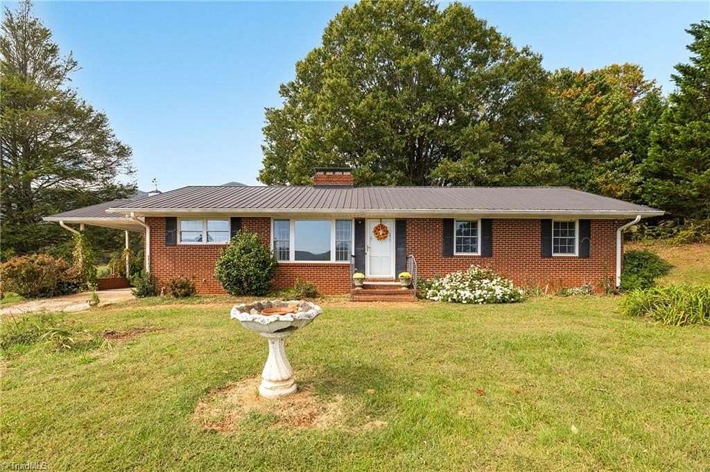 5.66 Acres of Land with Home for Sale in Lowgap, North Carolina