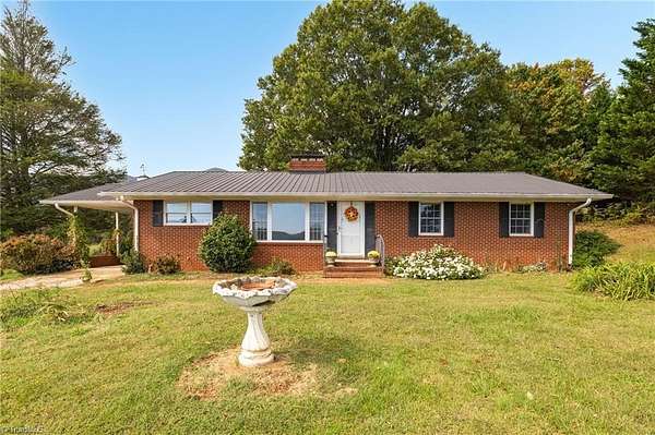 5.66 Acres of Land with Home for Sale in Lowgap, North Carolina