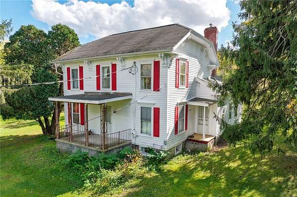 6.57 Acres of Land with Home for Sale in Newfield, New York