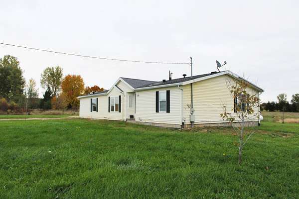 2 Acres of Land with Home for Sale in Sand Lake, Michigan
