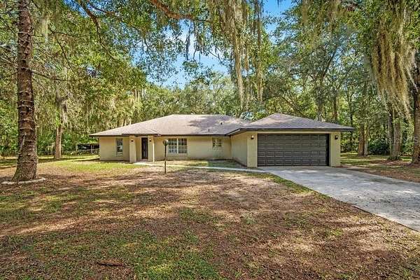 3.56 Acres of Land with Home for Sale in Oak Hill, Florida