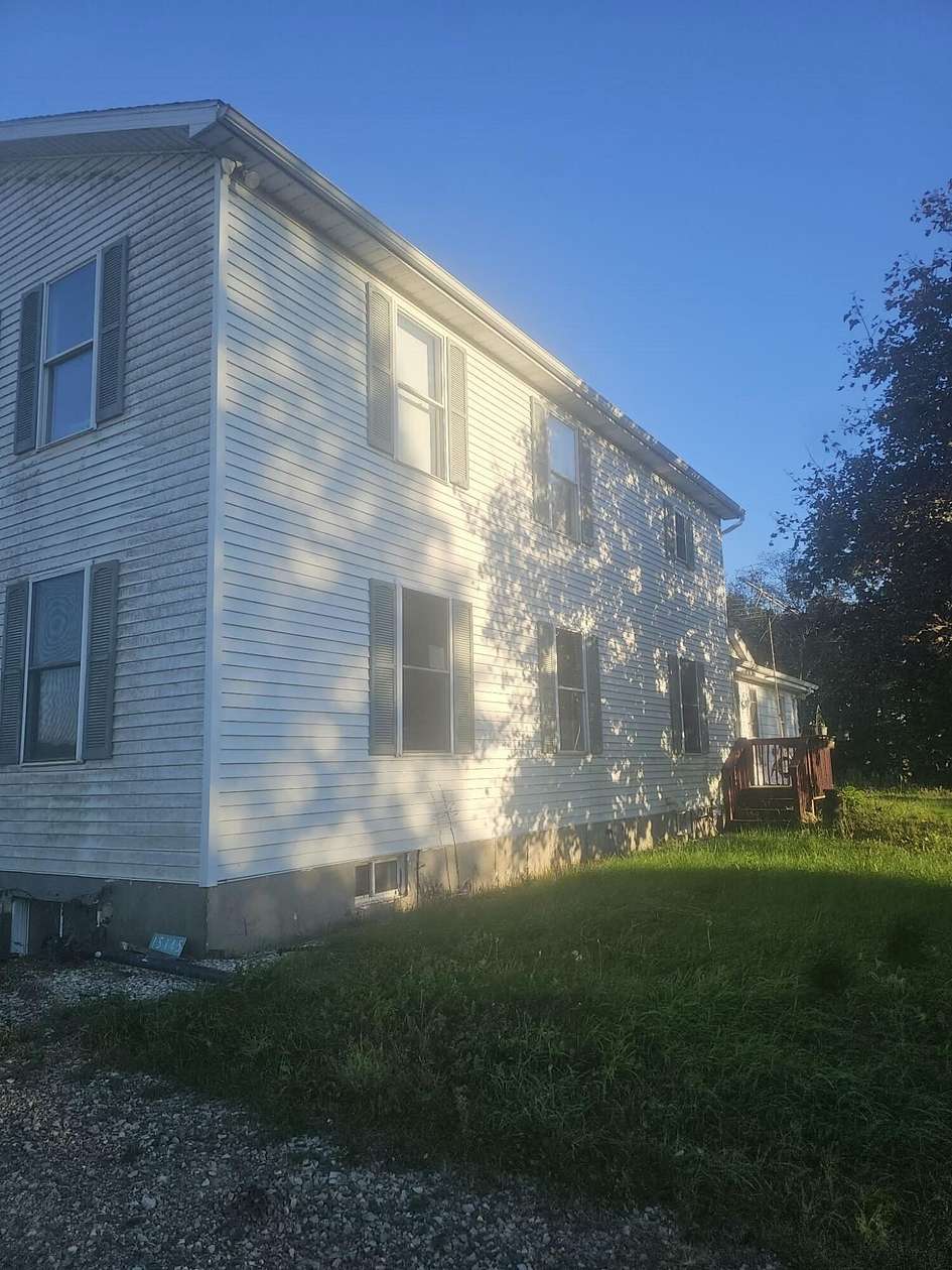 54.9 Acres of Land with Home for Sale in Hickory Corners, Michigan