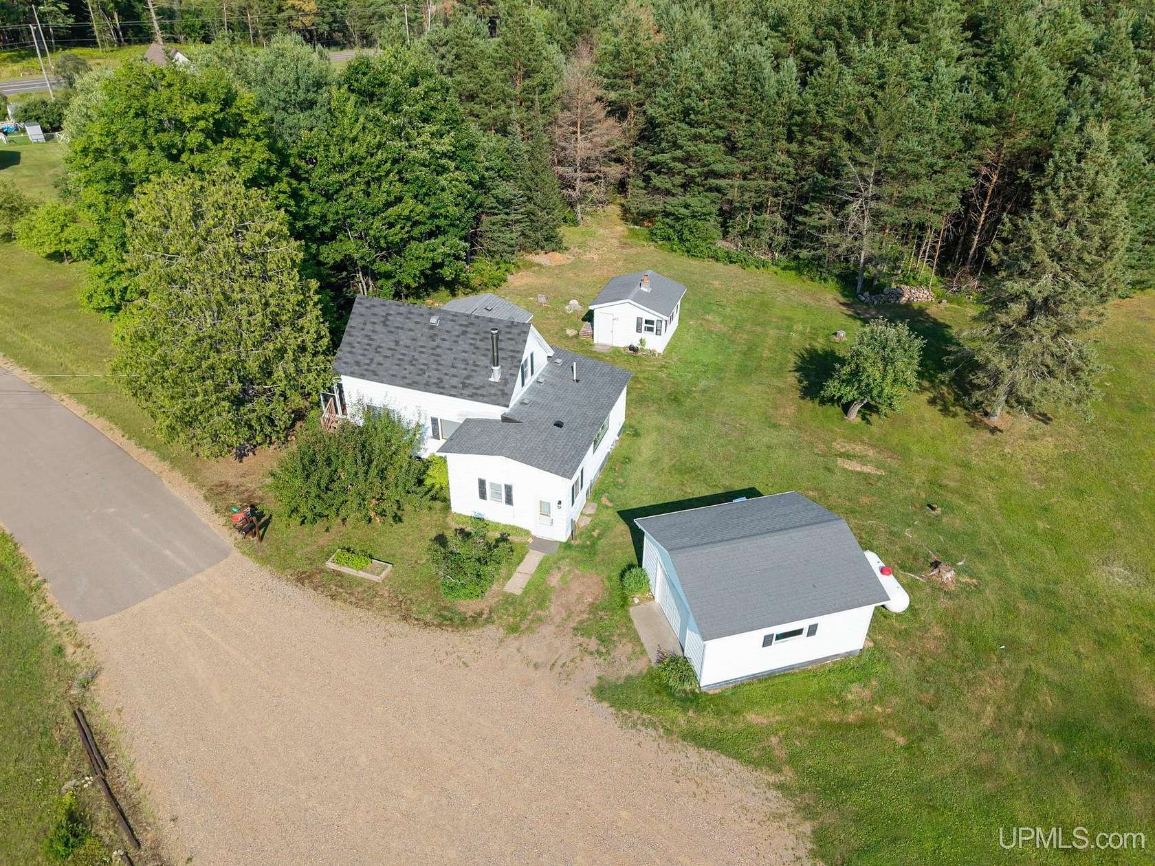 83 Acres of Recreational Land with Home for Sale in Champion, Michigan