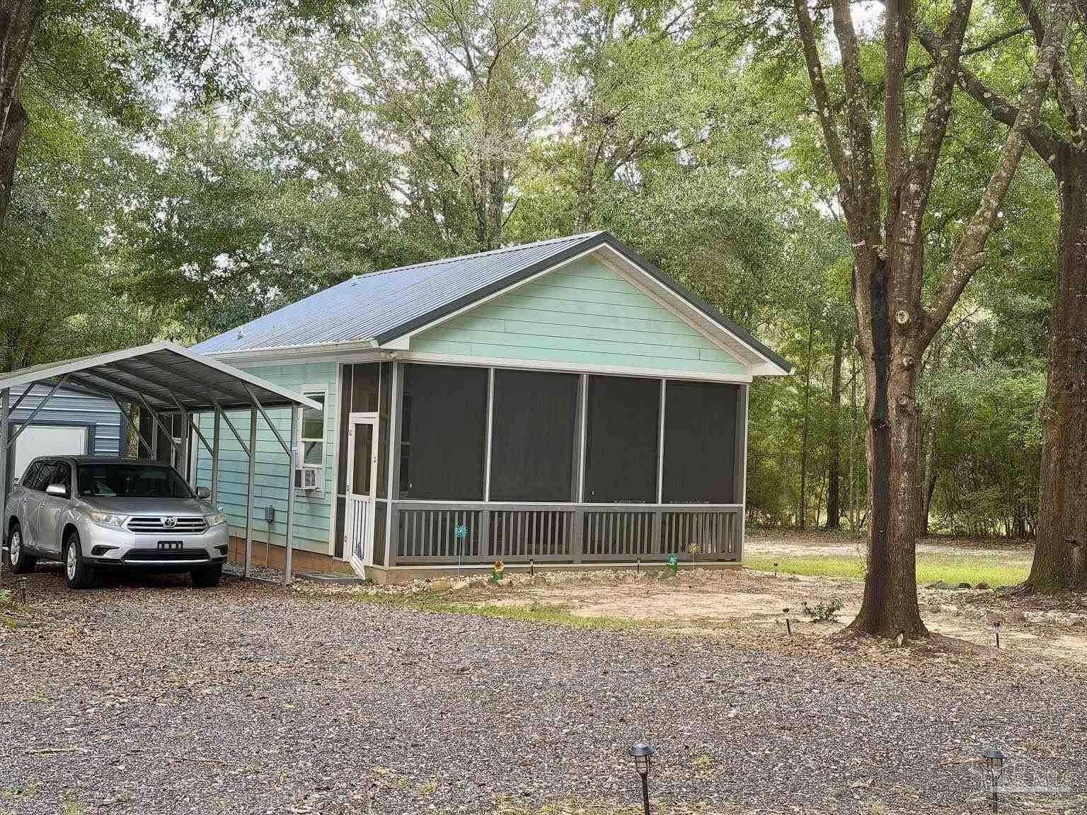 0.58 Acres of Land with Home for Sale in Milton, Florida