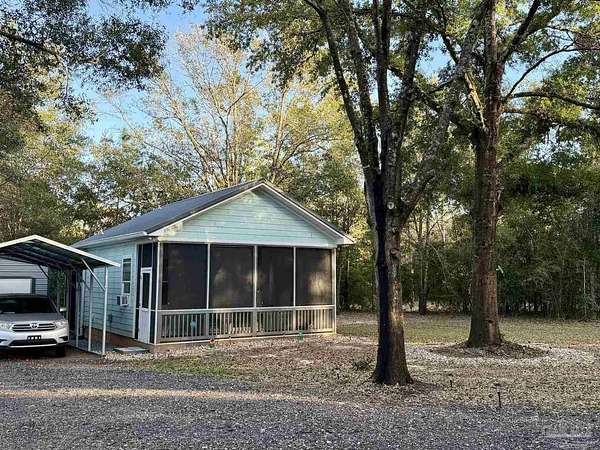 0.58 Acres of Land with Home for Sale in Milton, Florida