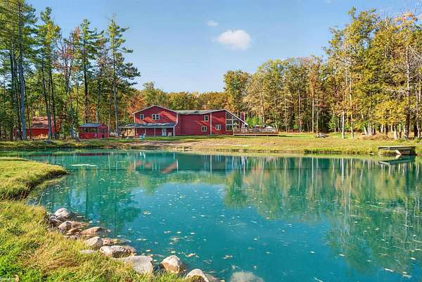 37.4 Acres of Recreational Land with Home for Sale in Hubbard Lake, Michigan