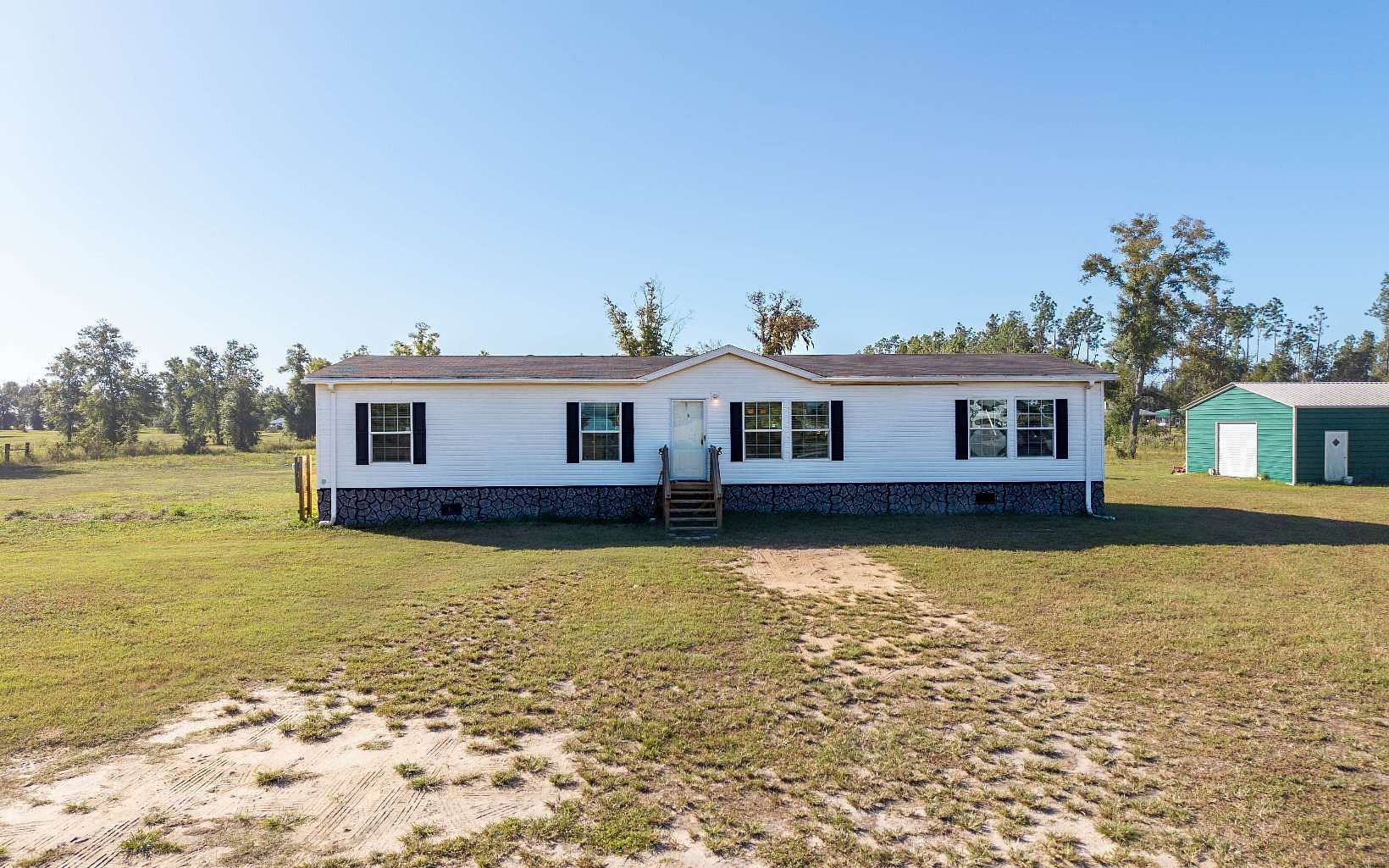 9.87 Acres of Land with Home for Sale in Live Oak, Florida