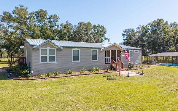 10.4 Acres of Land with Home for Sale in McAlpin, Florida