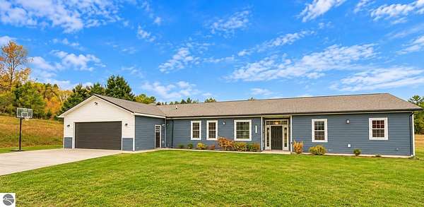 12.7 Acres of Recreational Land with Home for Sale in Cedar, Michigan