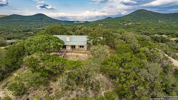 24.8 Acres of Recreational Land with Home for Sale in Utopia, Texas